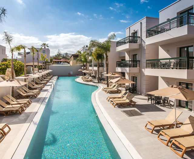 Gouves Park entire length of the pool with sunbeds and umbrellas alongside it