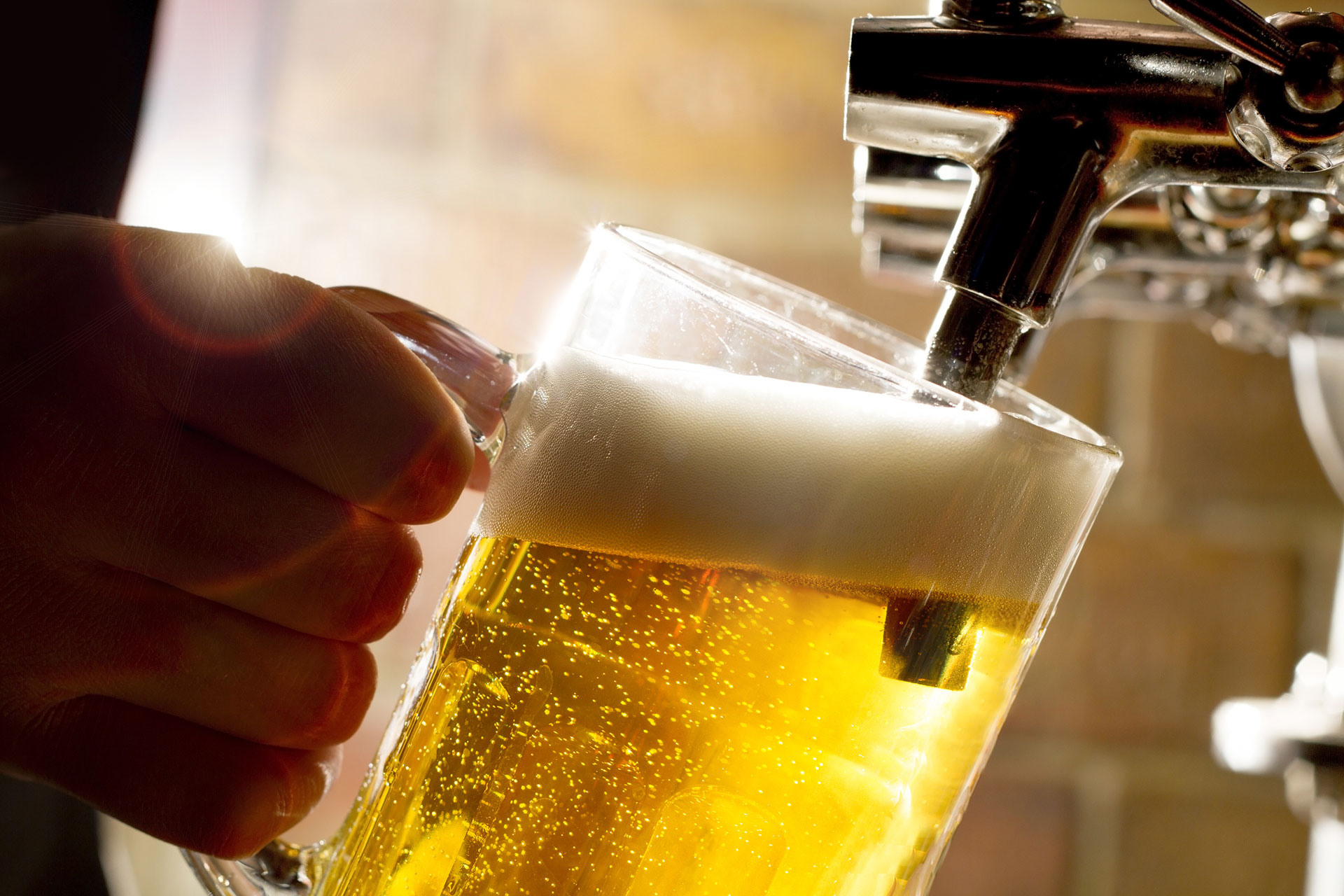 A beer being poured up close