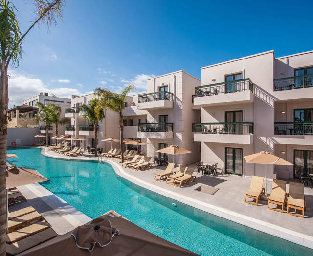 Gouves Park long pool with sunbeds and umbrellas alongside it and the hotel in the background
