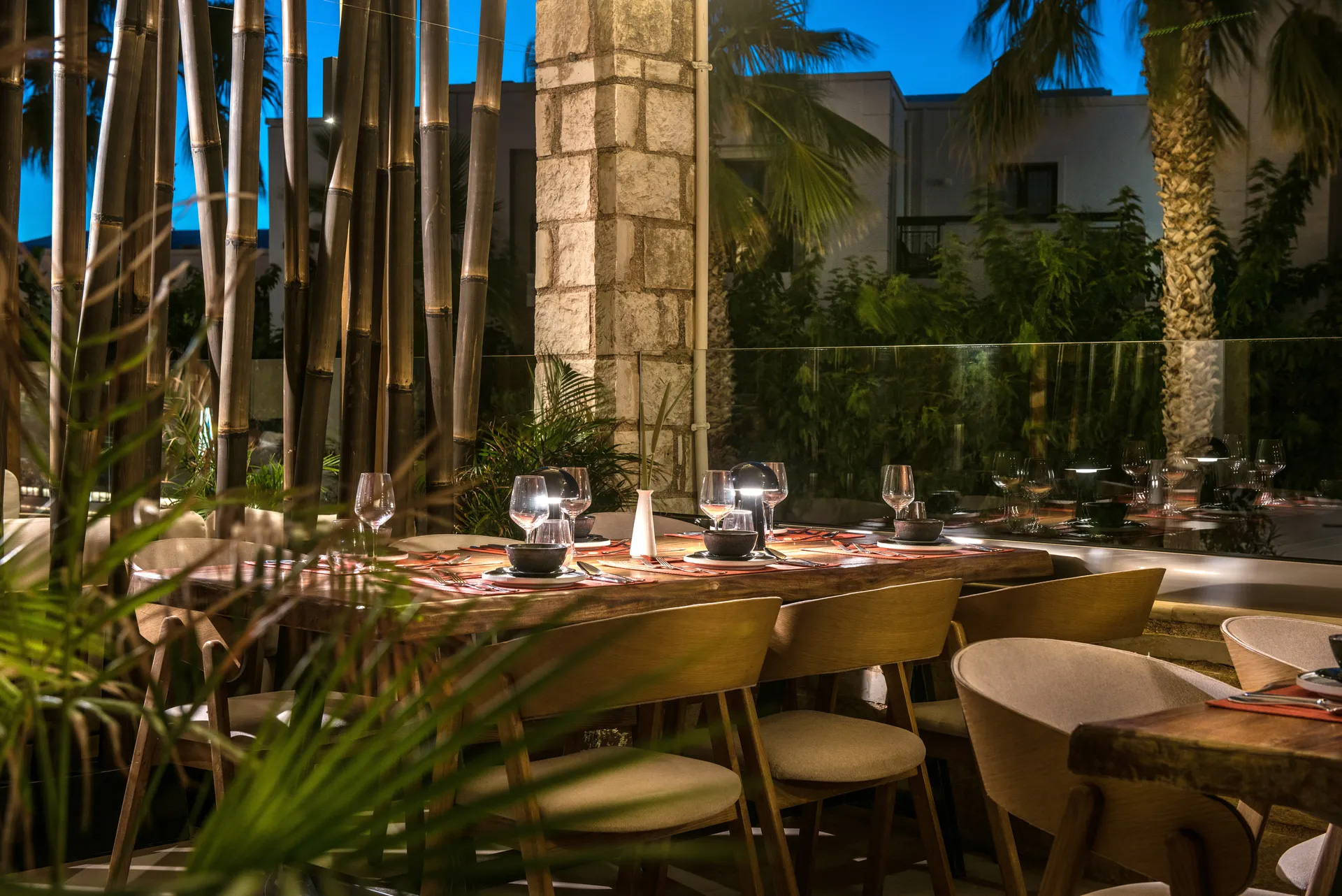 Gouves Park Umami Asian Restaurant balcony tables decorated with plates, glasses and cutlery