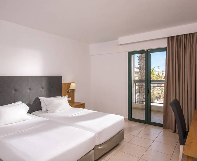 Gouves Park Family Room double bed, a big desk and amenities