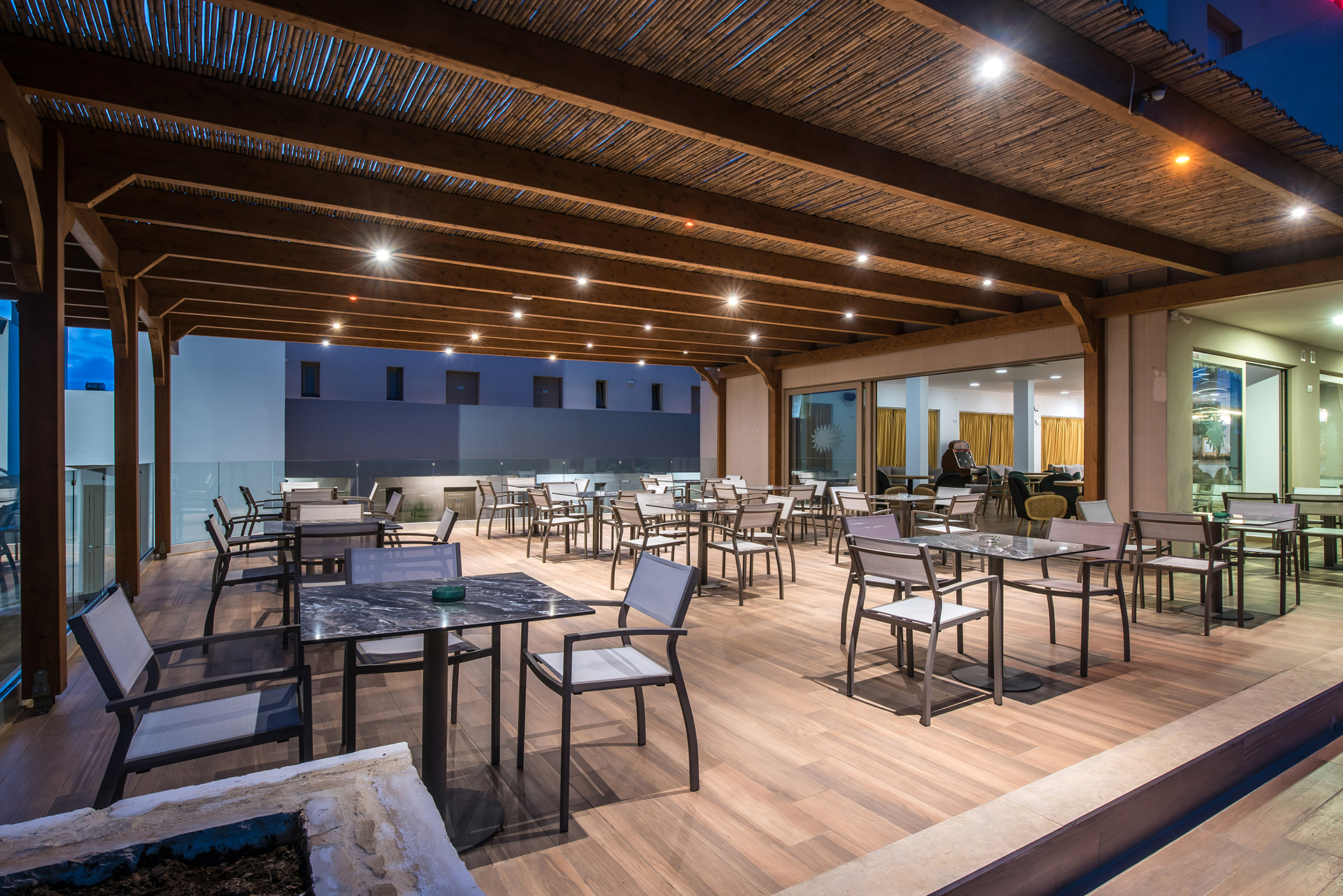 Gouves Park Zeus Bar outdoor sitting area lit up at night time