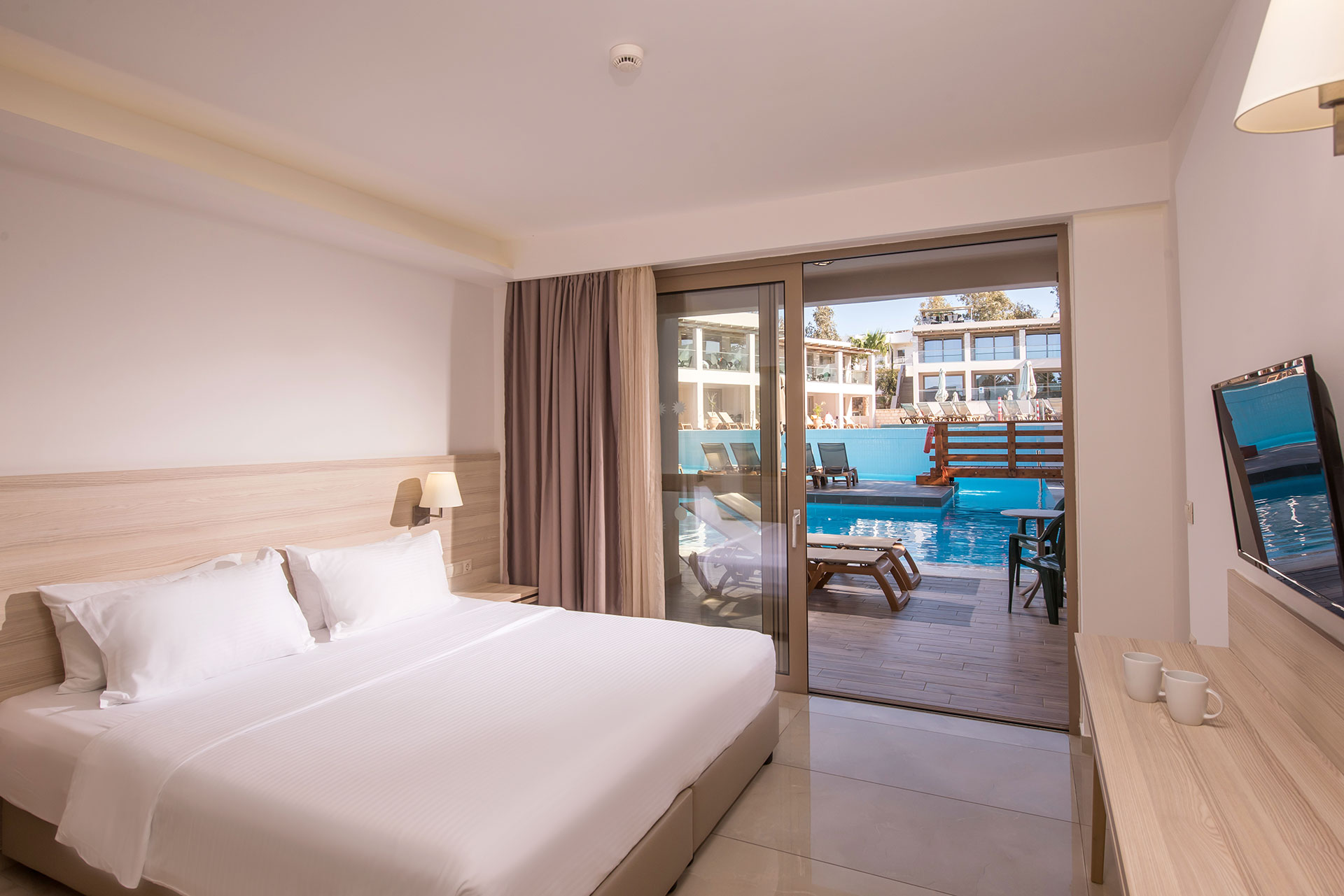 Gouves Park Family Suite Swim Up double bed, balcony view and amenities