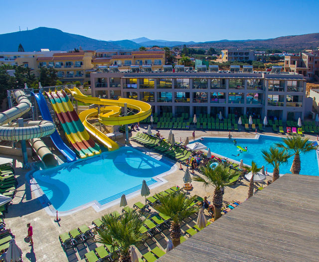 Gouves Park Slides Park slides, two pools, sunbeds, palm trees and the hotel in the background