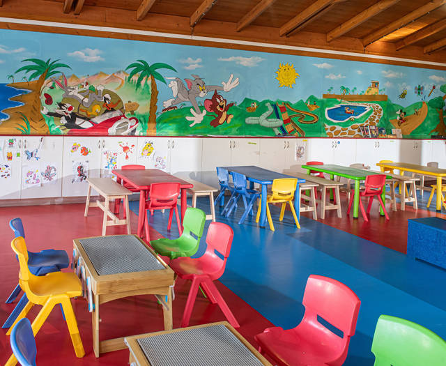 Gouves Park Kids Club indoor playground with a lot of play tables