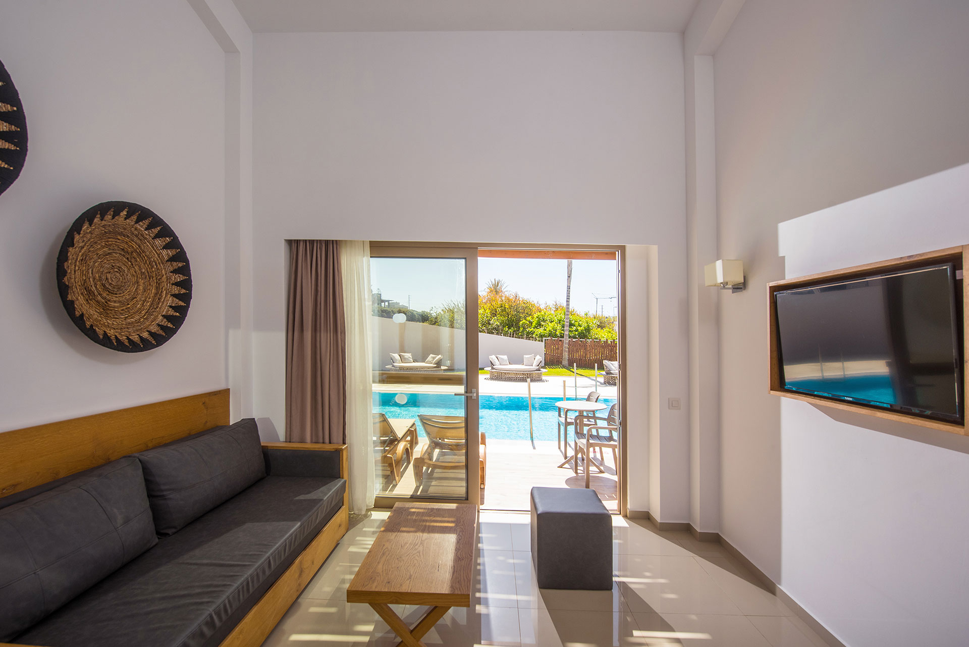 Gouves Park Maisonette Swim Up living room with couch, table, amenities and terrace view