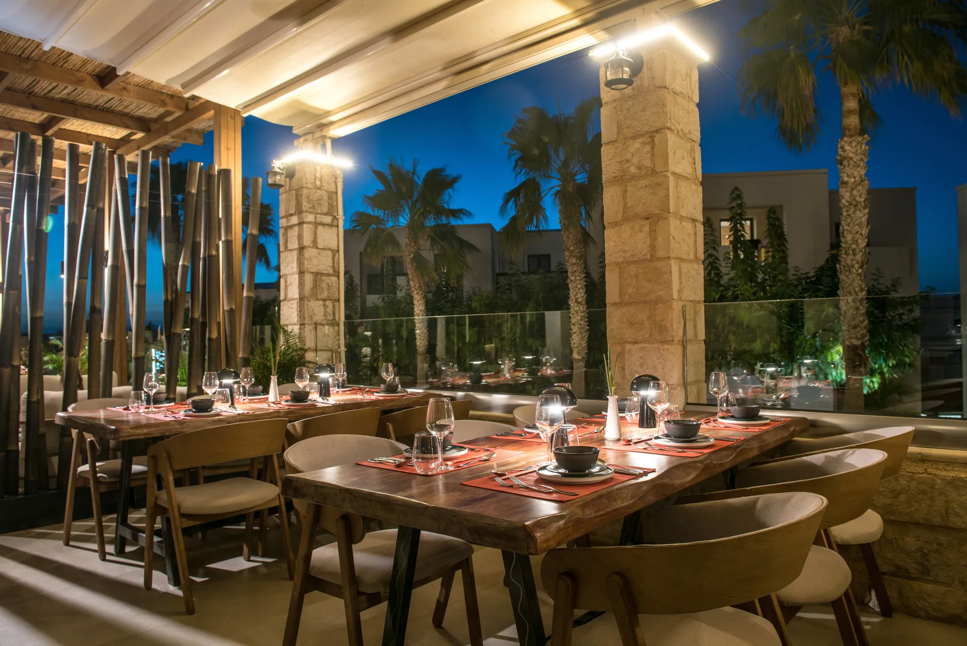 Gouves Park Umami Asian Restaurant balcony sitting area lit up at night time