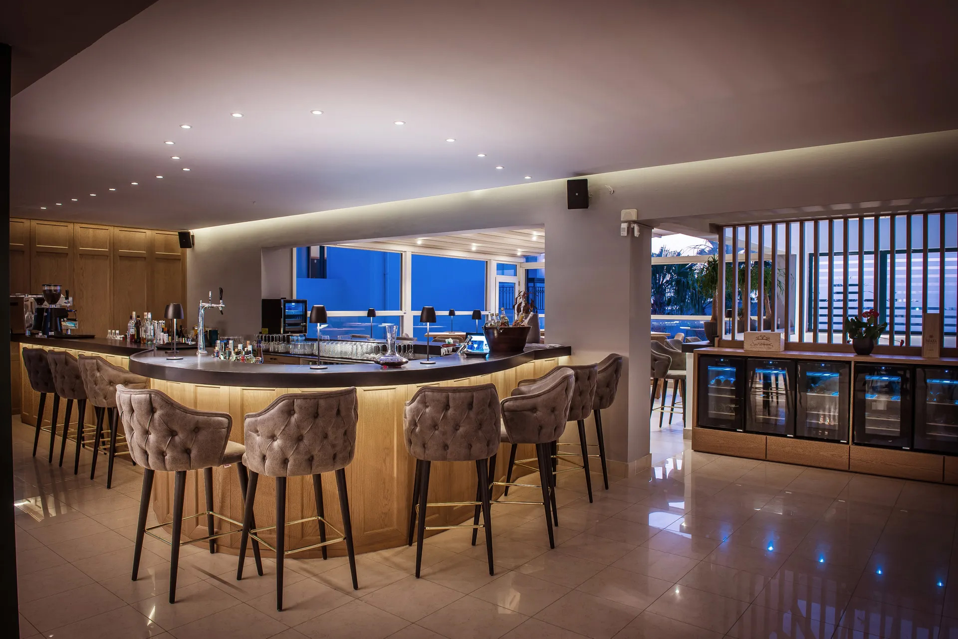 Gouves Park Hermes Wine Bar bar with tall chair-like stools