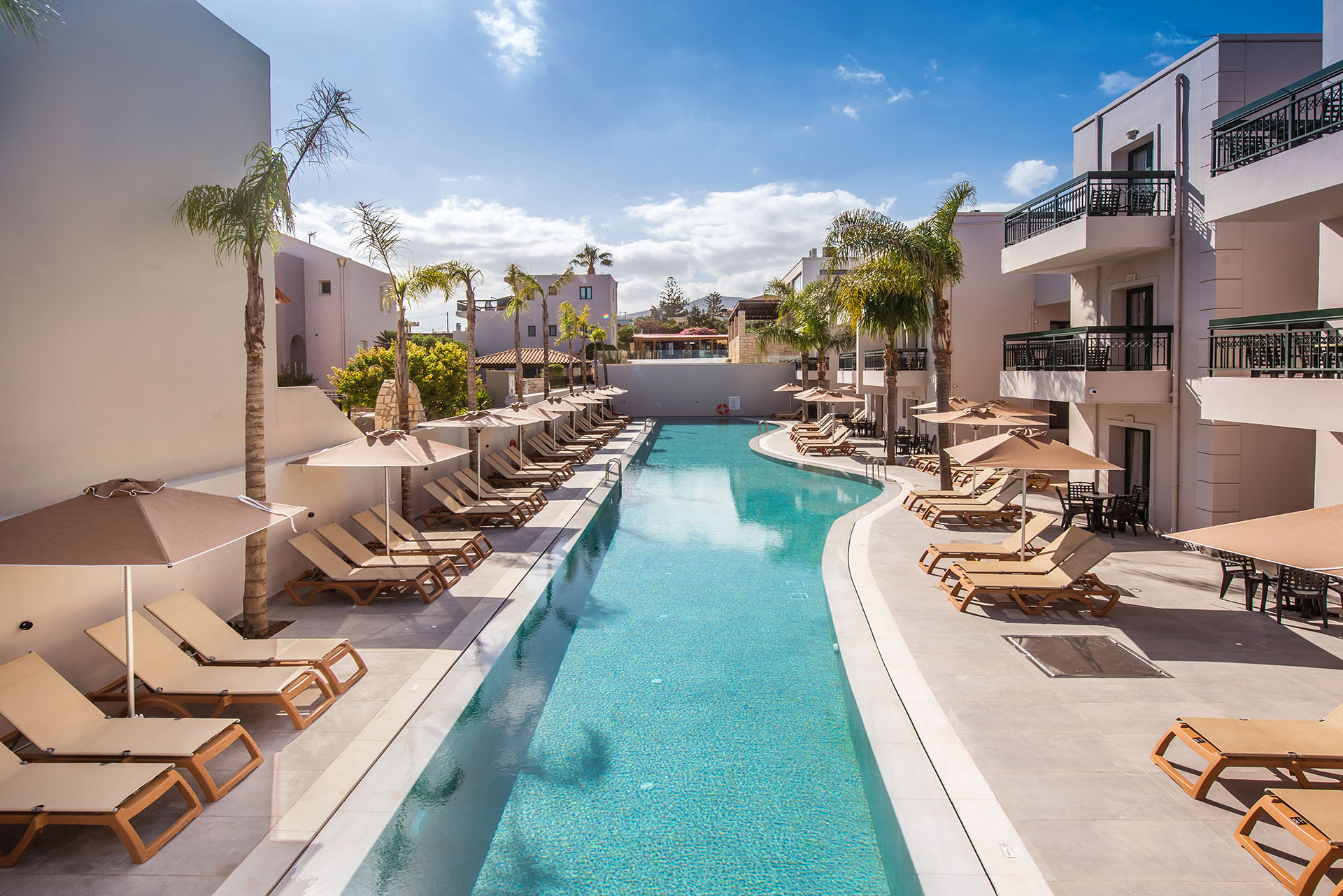 Gouves Park long pool with sunbeds and umbrellas alongside it